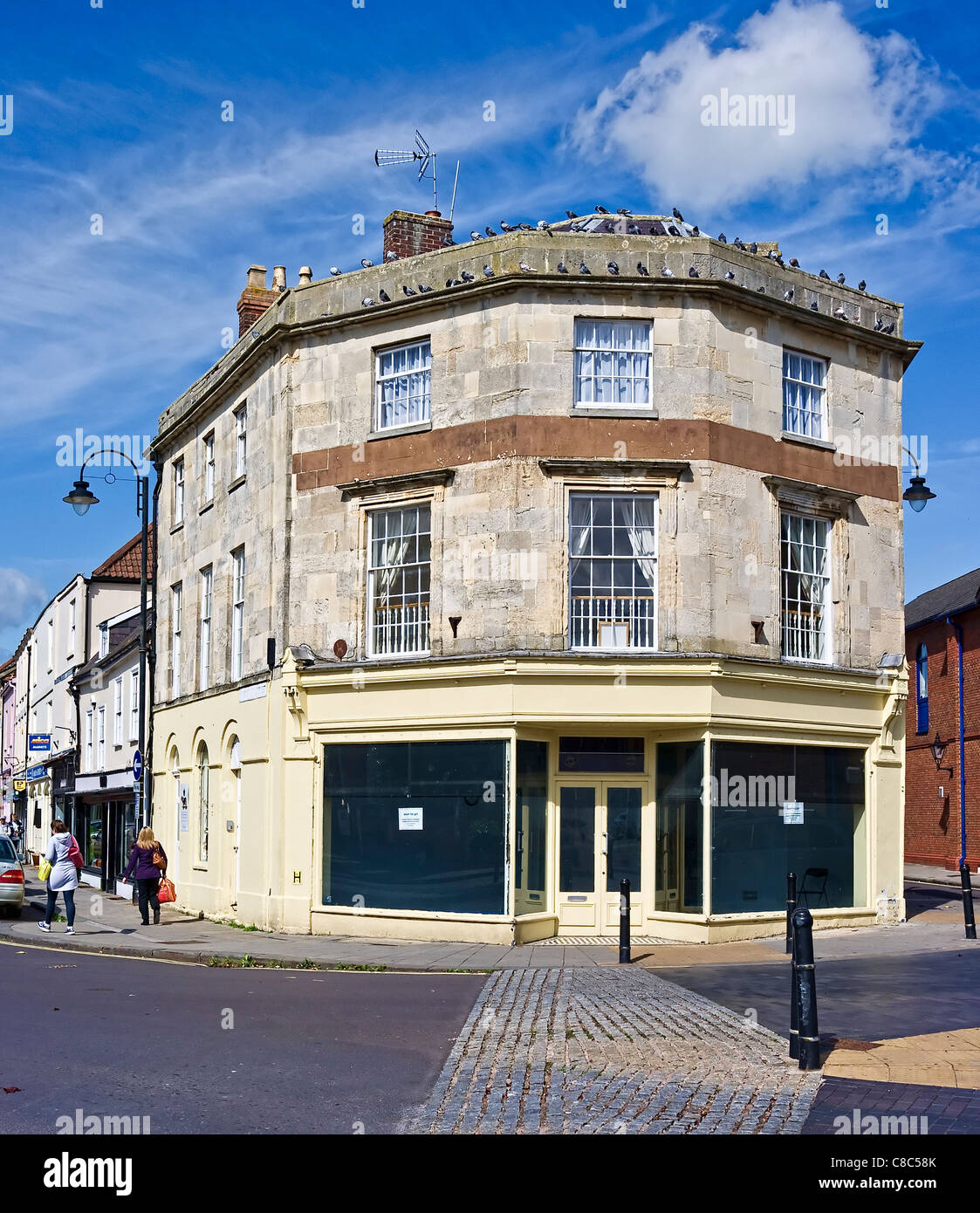 Empty commercial retail premises at prominent junction in centre of Devizes town Wiltshire England uk Stock Photo