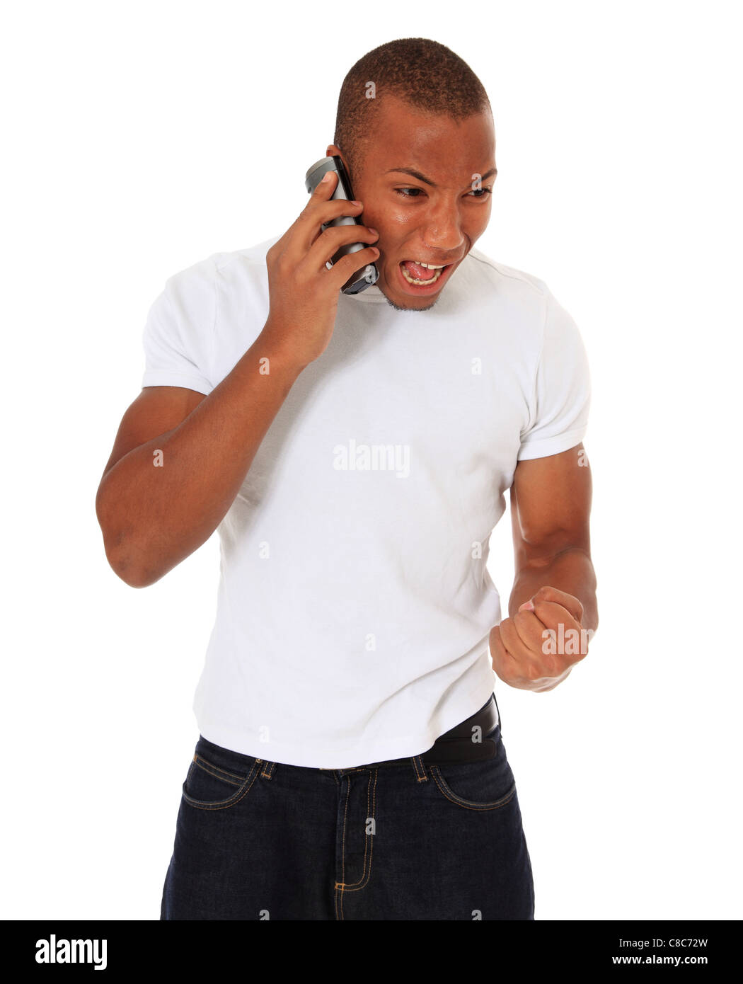 Attractive black man being angry during phone call. All on white background. Stock Photo