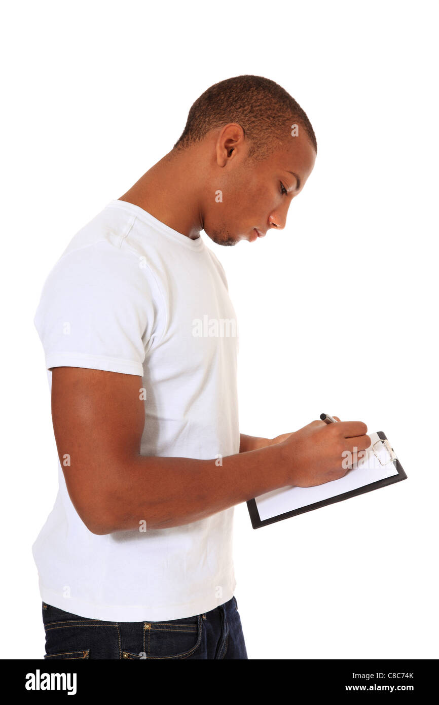 Attractive black man writing on clipboard. All on white background. Stock Photo