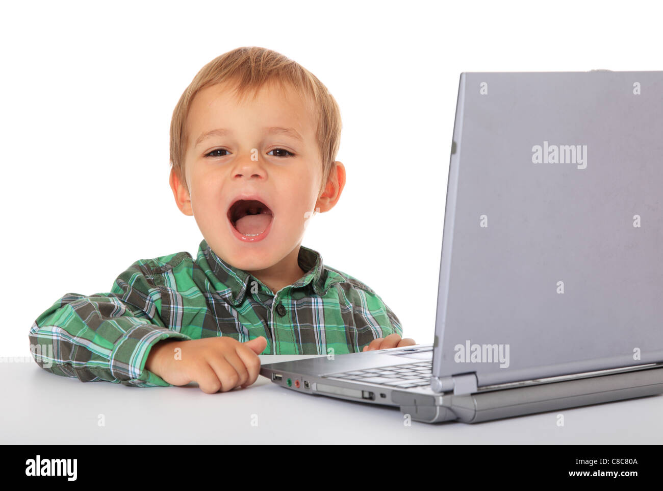 Cute caucasian boy using laptop. All on white background Stock Photo ...