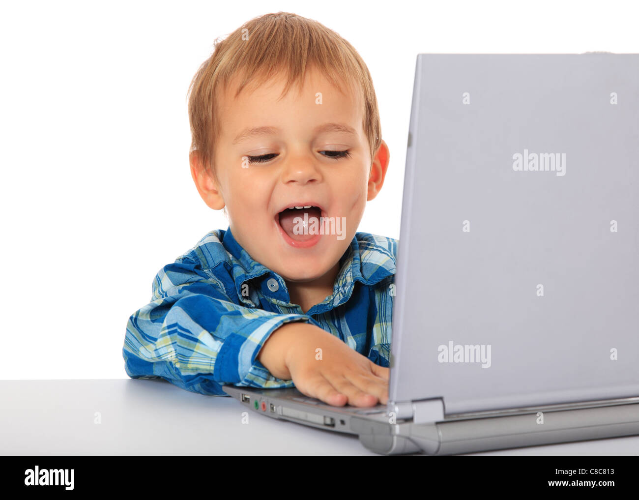Cute caucasian boy using laptop. All on white background Stock Photo ...