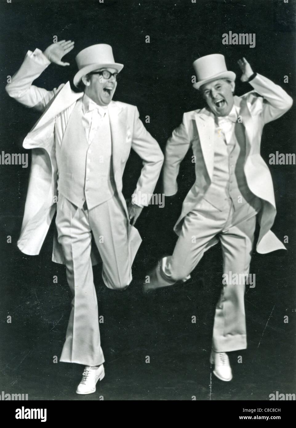 MORECAMBE AND WISE  English TV comedy duo with Eric Morecambe at left and Ernie Wise on their Thames TV show about 1980 Stock Photo