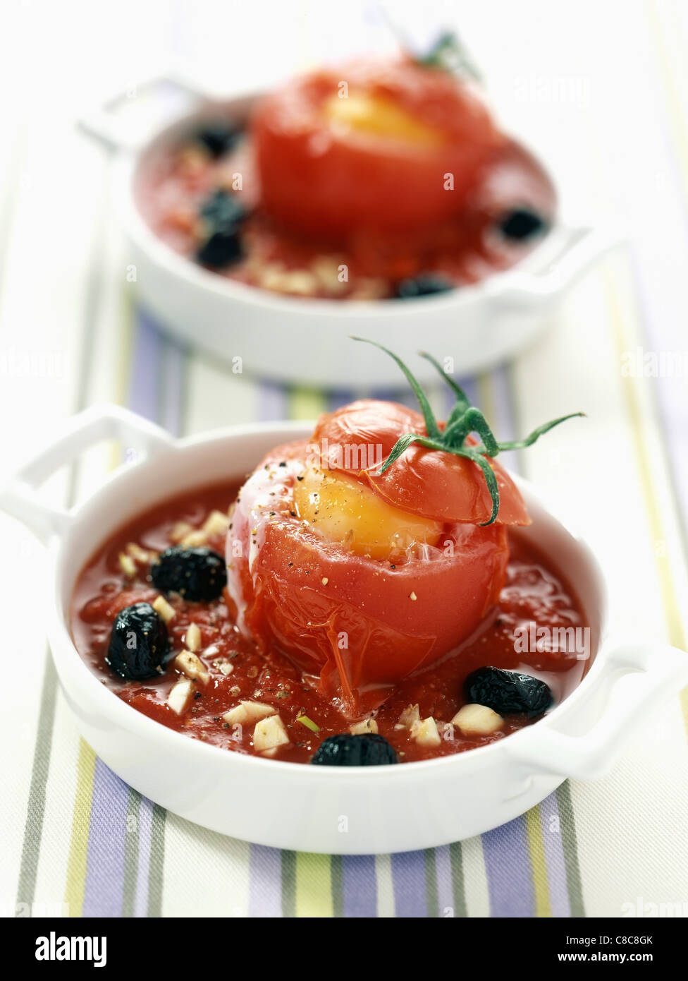 Tomatoes stuffed with eggs and goat cheese Stock Photo
