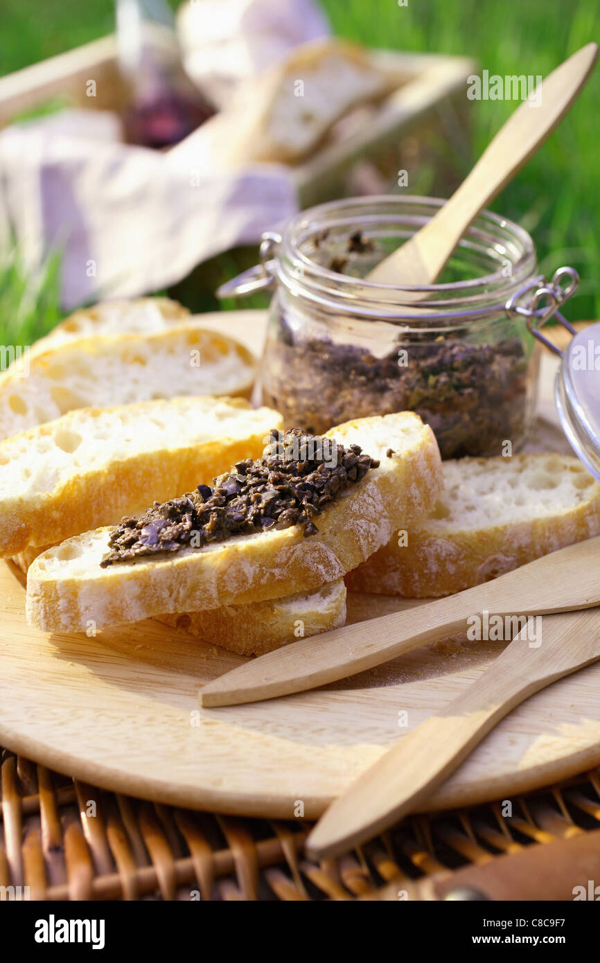 tapenade on sliced bread Stock Photo Alamy