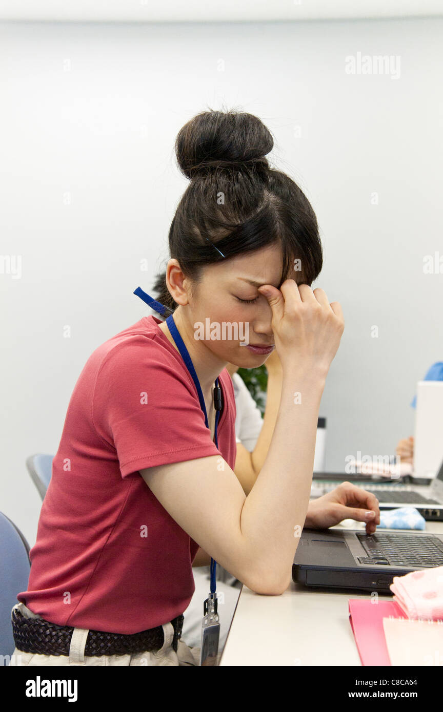 Young woman suffering from headache Stock Photo