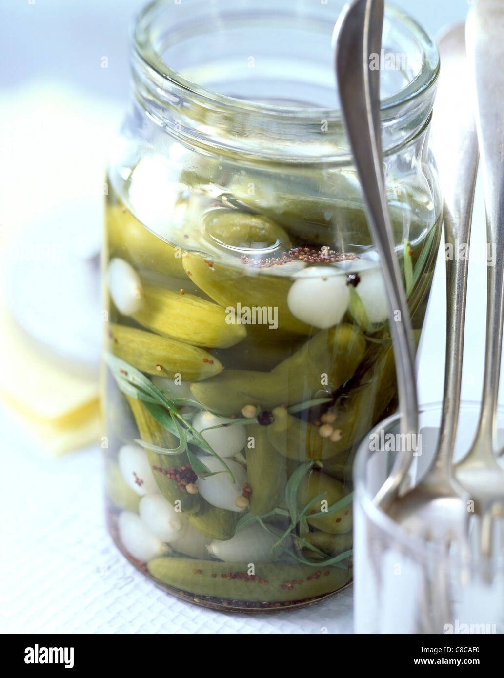 gherkins and baby onions pickled in vinegar Stock Photo Alamy