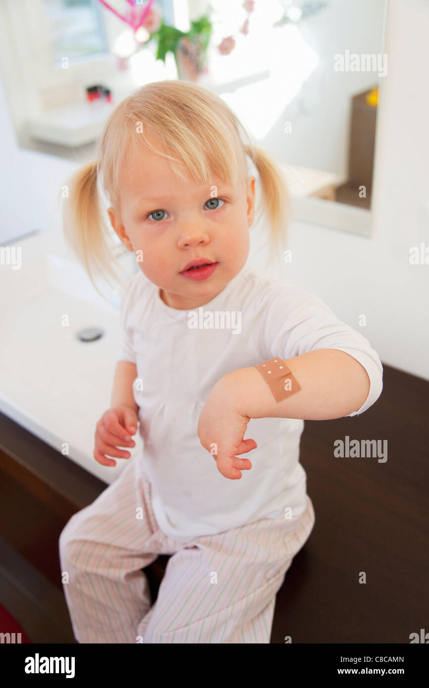 Toddler girl wearing bandage Stock Photo Alamy