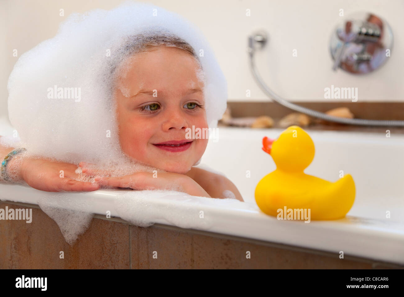 Boy covered in bubbles in bathtub Stock Photo Alamy