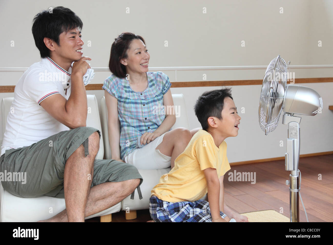 Family relaxing at living room Stock Photo