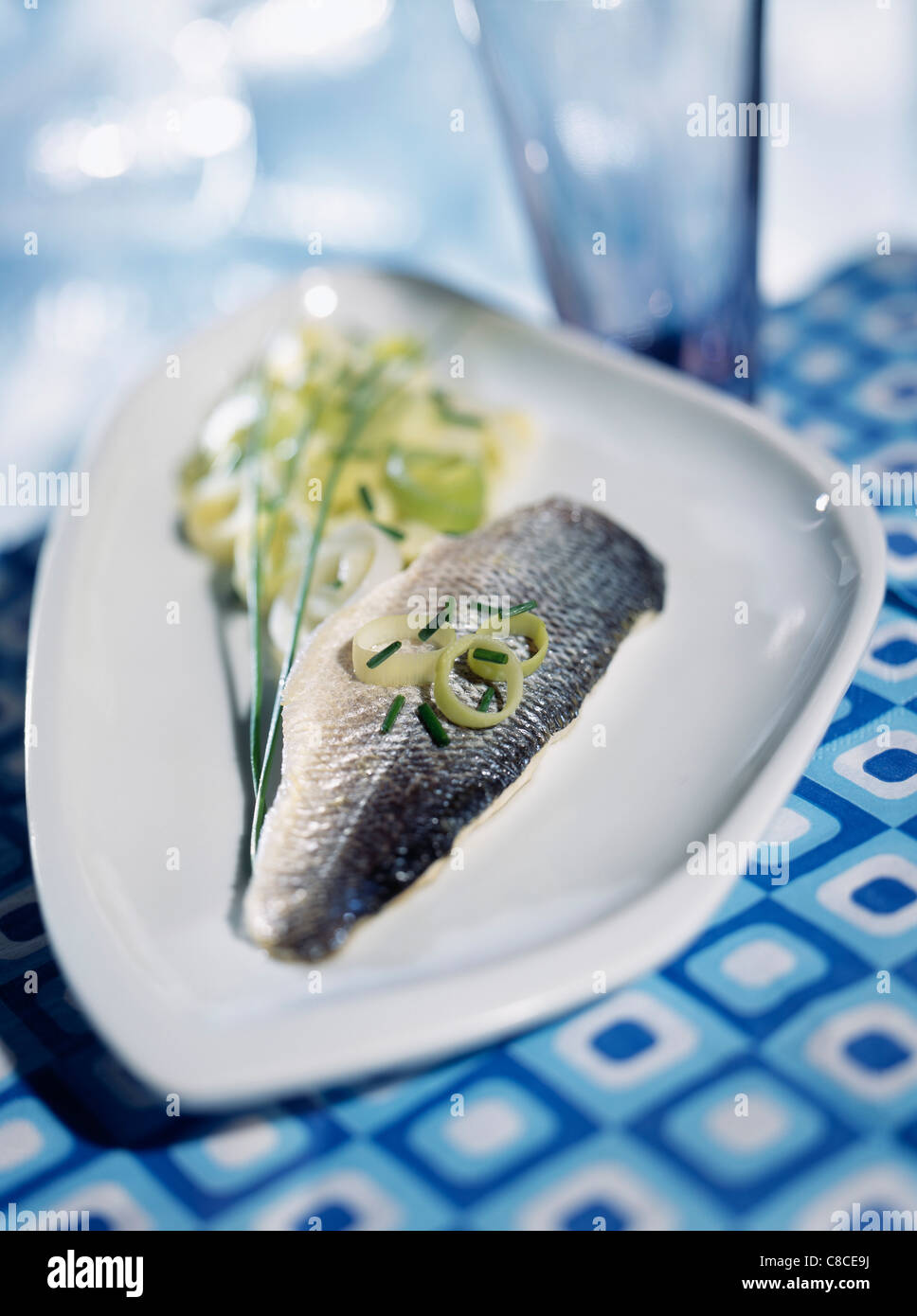 Bass on leek fondue with herbs Stock Photo Alamy