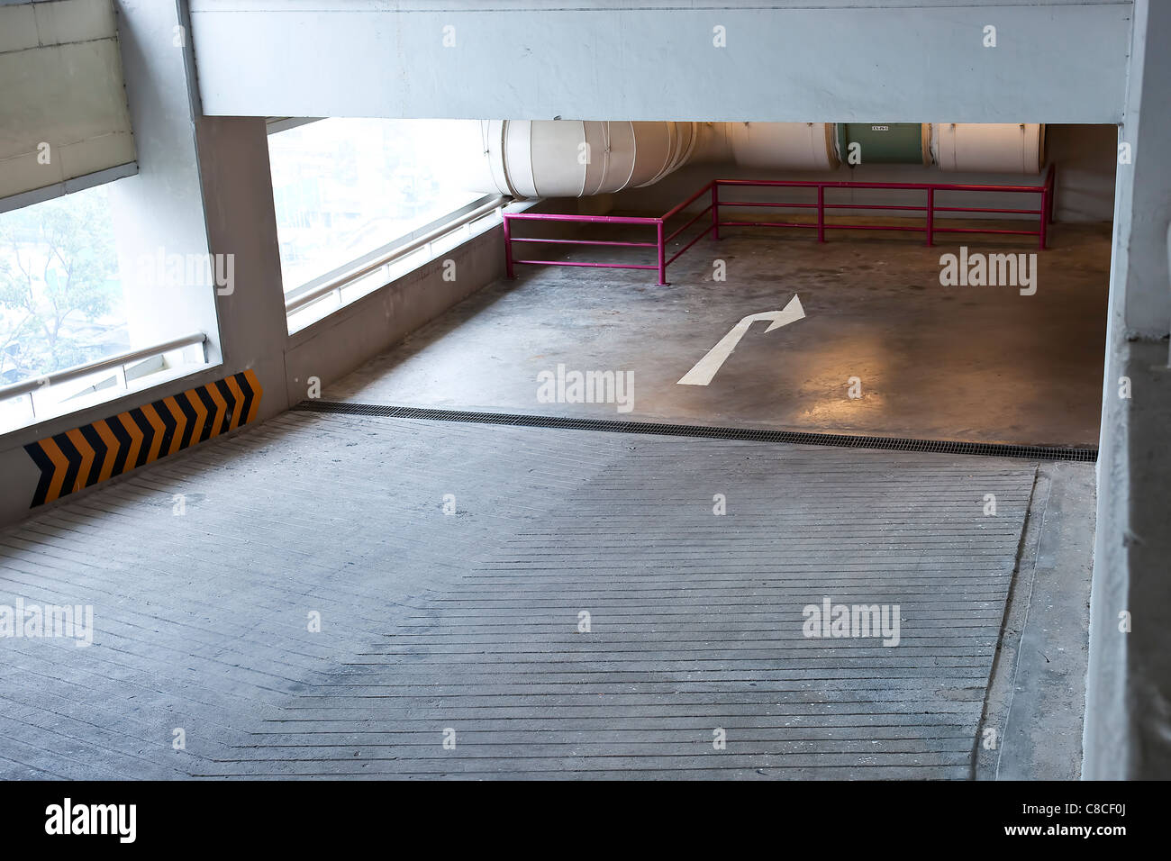 ramp lane from upper floor to lower floor in car parking lot Stock Photo