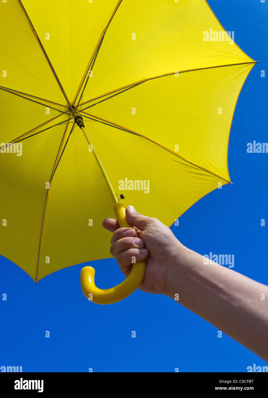 yellow umbrella under blue sky Stock Photo Alamy