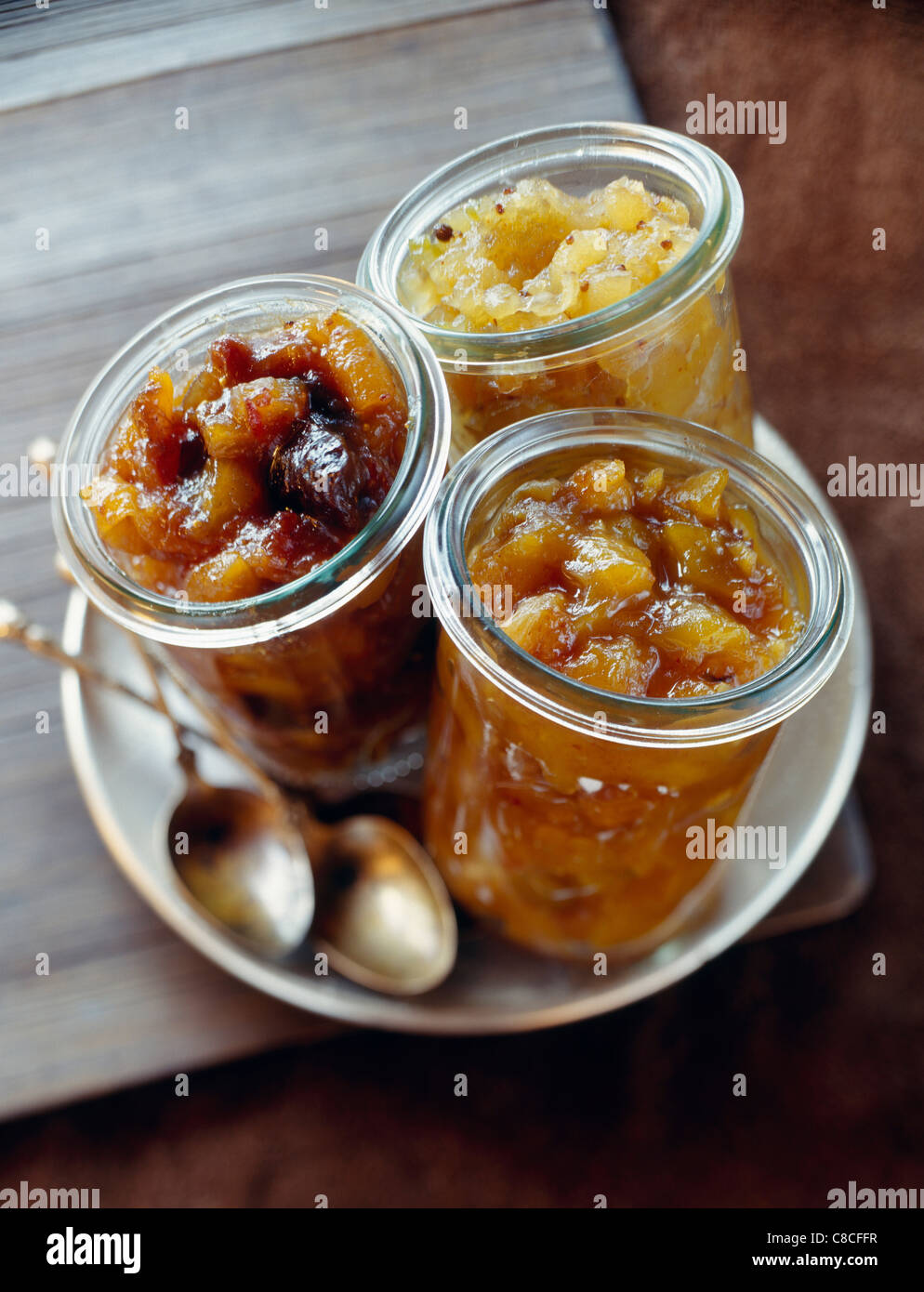 Apple chutney,mango chutney and dried fruit chutney Stock Photo Alamy