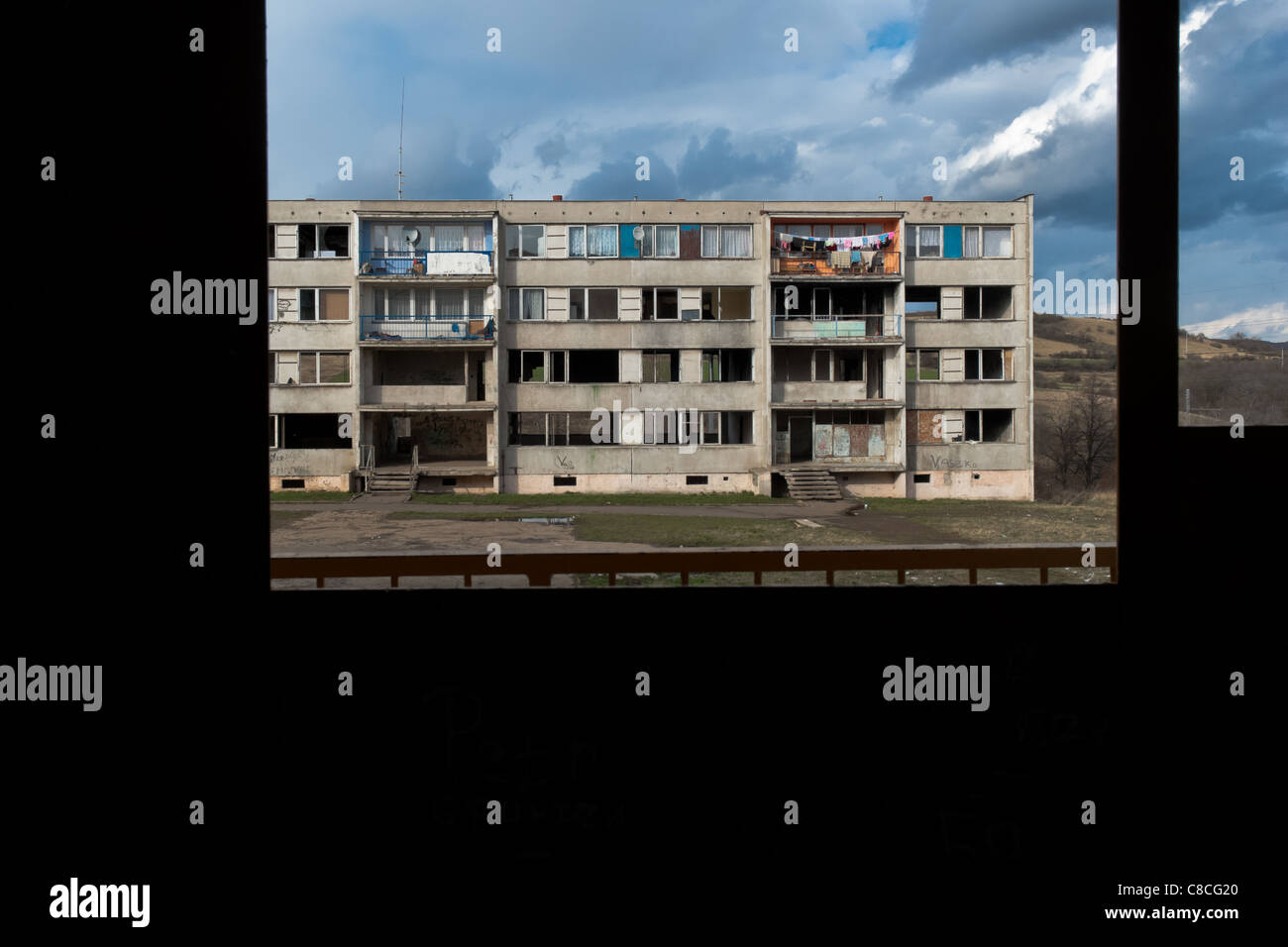 A devastated apartment block seen through an empty window in the Gipsy  ghetto of Chanov on outskirts of Most, Czech Republic Stock Photo - Alamy