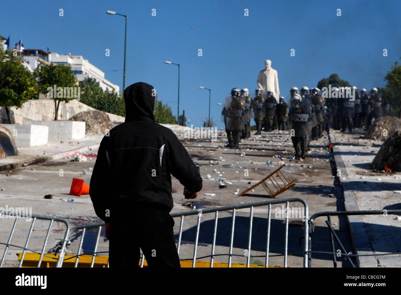 Athens Greece, 19/10/2011. Protesters clash with riot police, throwing fire bombs and stones. They were among thousands of people protesting in the Greek capital against proposed austerity measures. Stock Photo