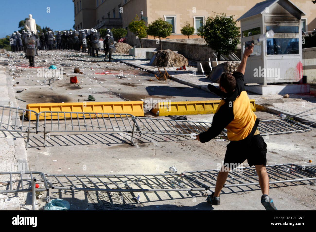 Athens Greece, 19/10/2011. Protesters clash with riot police outside the Greek Parliament, throwing fire bombs and stones. They were among thousands of people protesting in the Greek capital against proposed austerity measures. Stock Photo