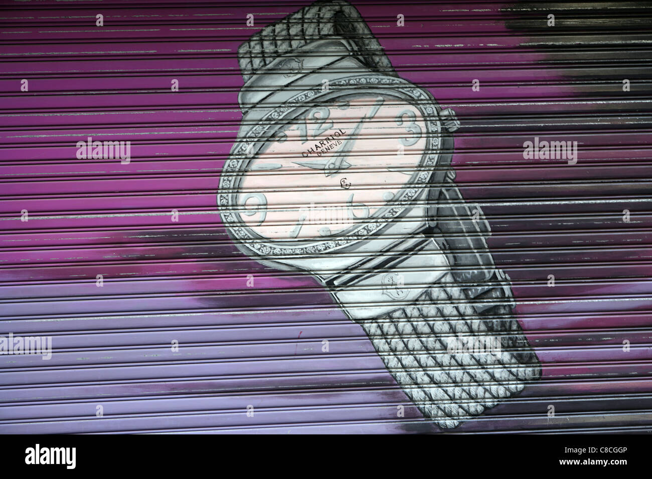 Painting of expensive Rolex watch on external shutter of closed jewelry shop in Hong Kong Stock Photo