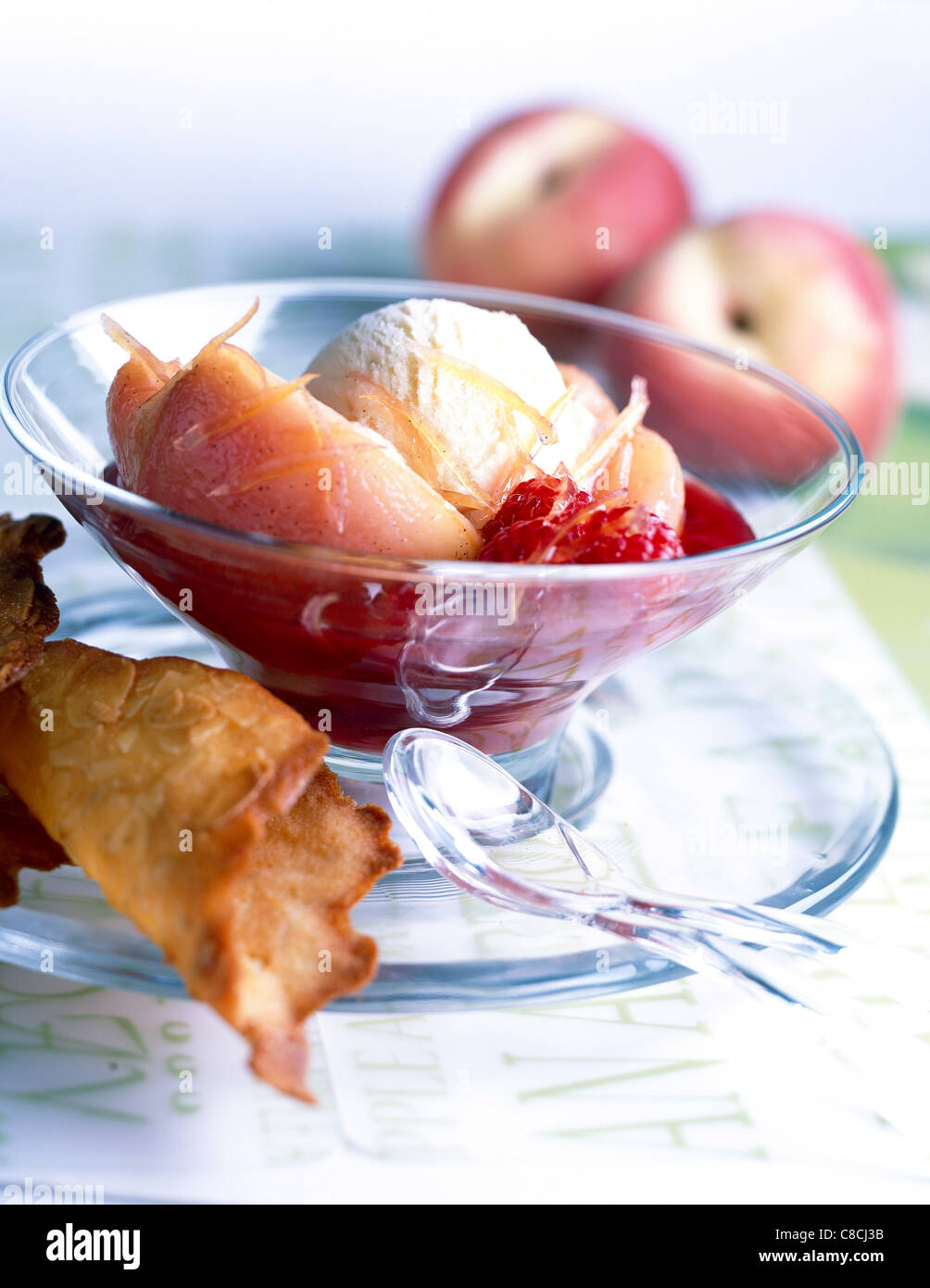 poached pears and vanilla ice cream with raspberry coulis Stock Photo