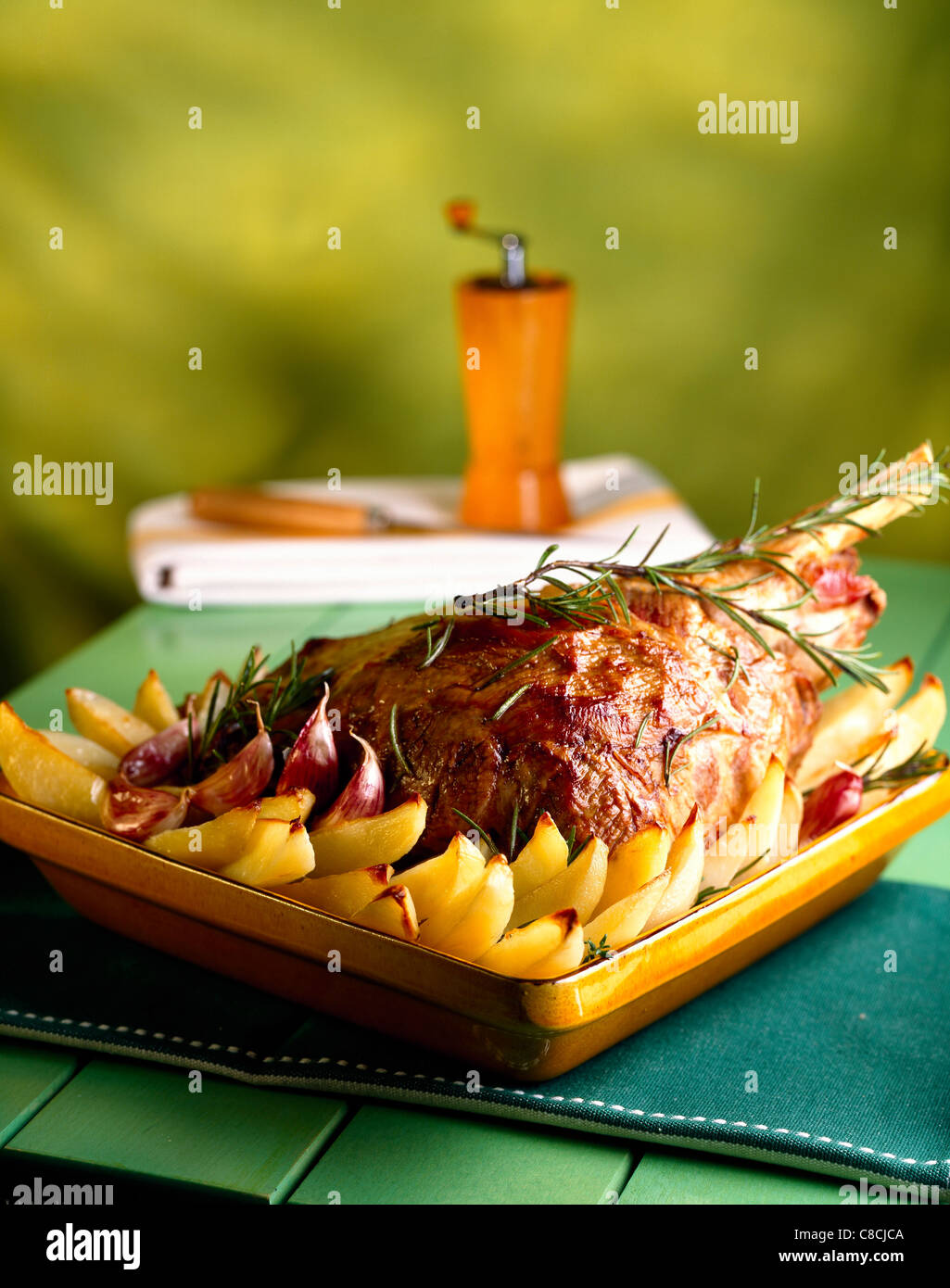 Roast leg of lamb with potatoes Stock Photo - Alamy