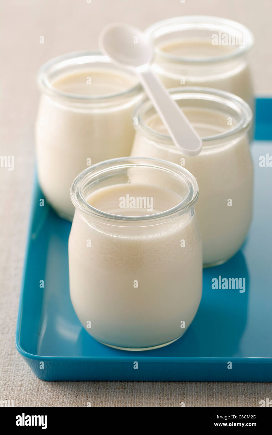 Pots of plain yoghurts Stock Photo