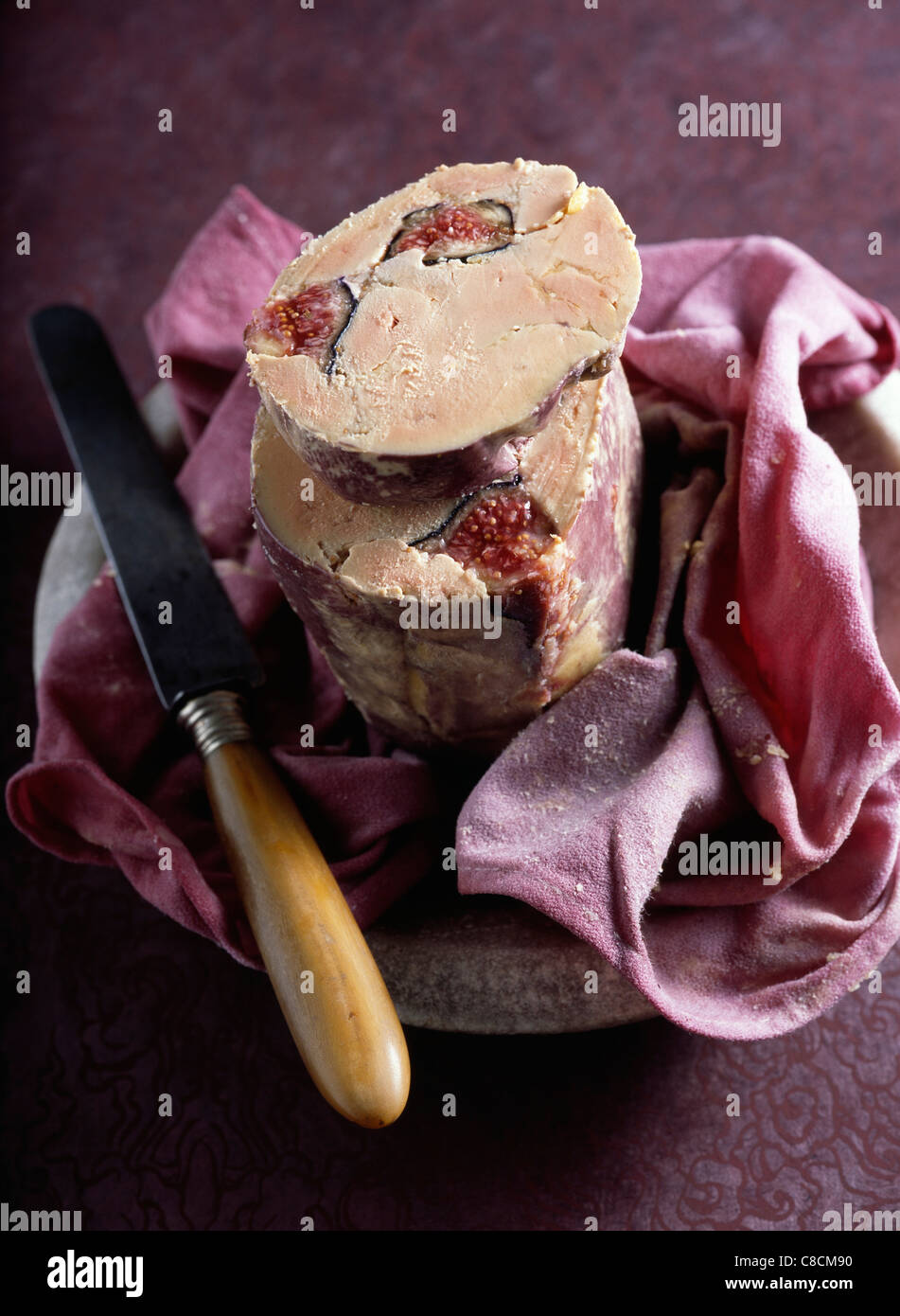 Cloth-wrapped foie gras with figs poached in red wine Stock Photo