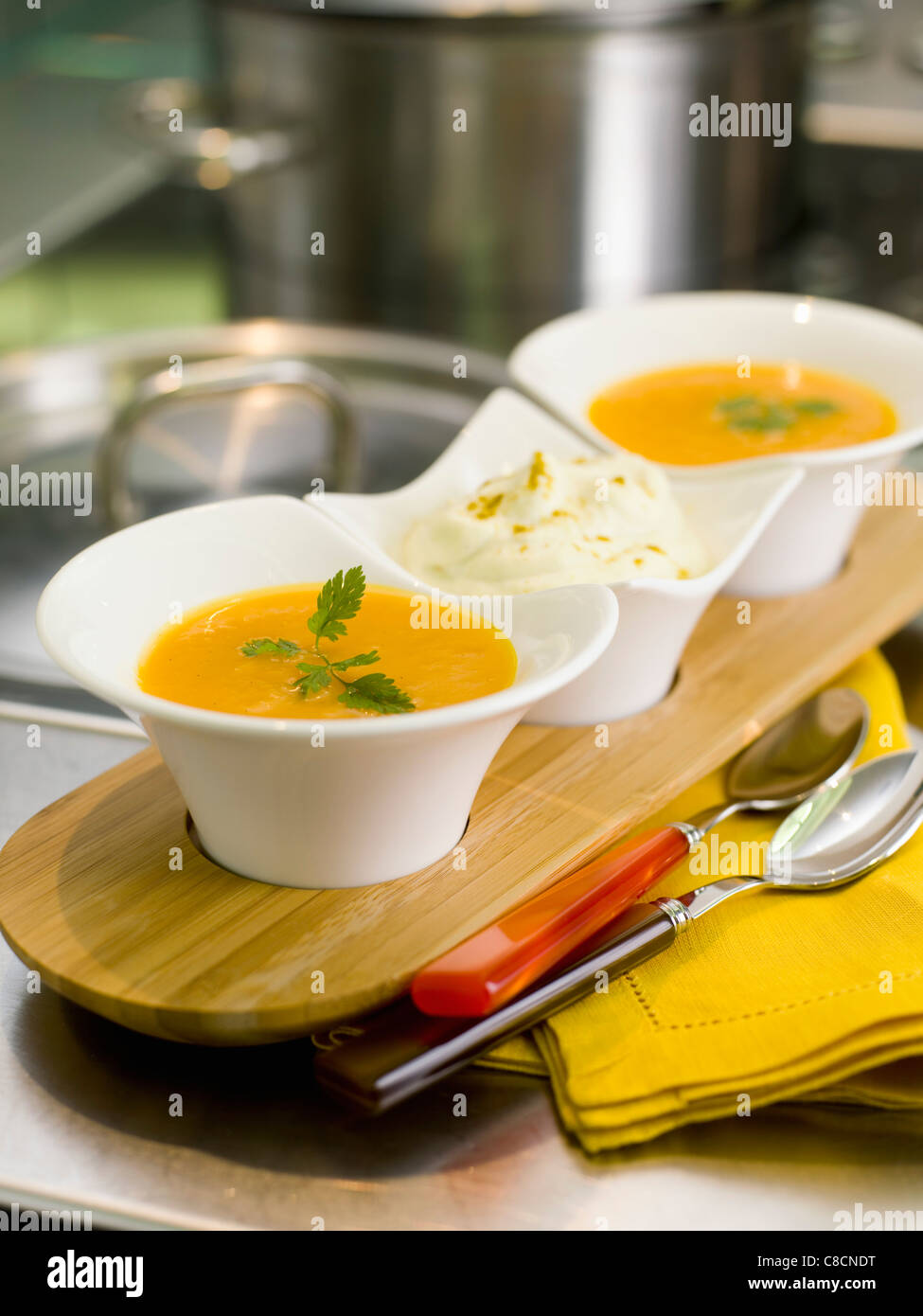 Pumpkin and vanilla soup with curried whipped cream Stock Photo