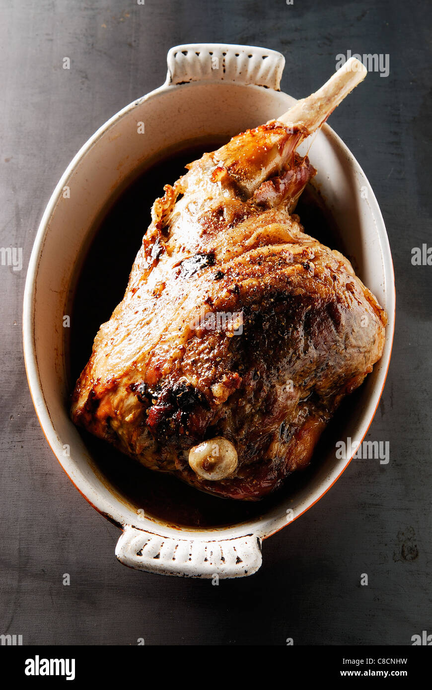 Leg of lamb cooked seven hours in the oven,served with a spoon Stock