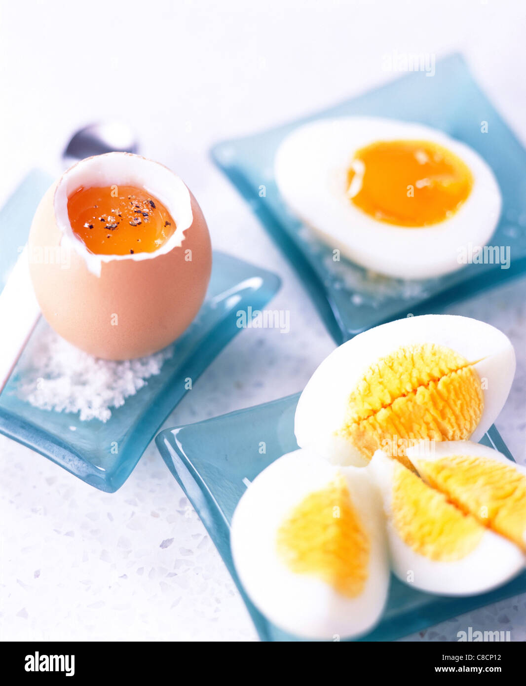 Selection of cooked eggs - soft-boiled, hard-boiled and runny Stock