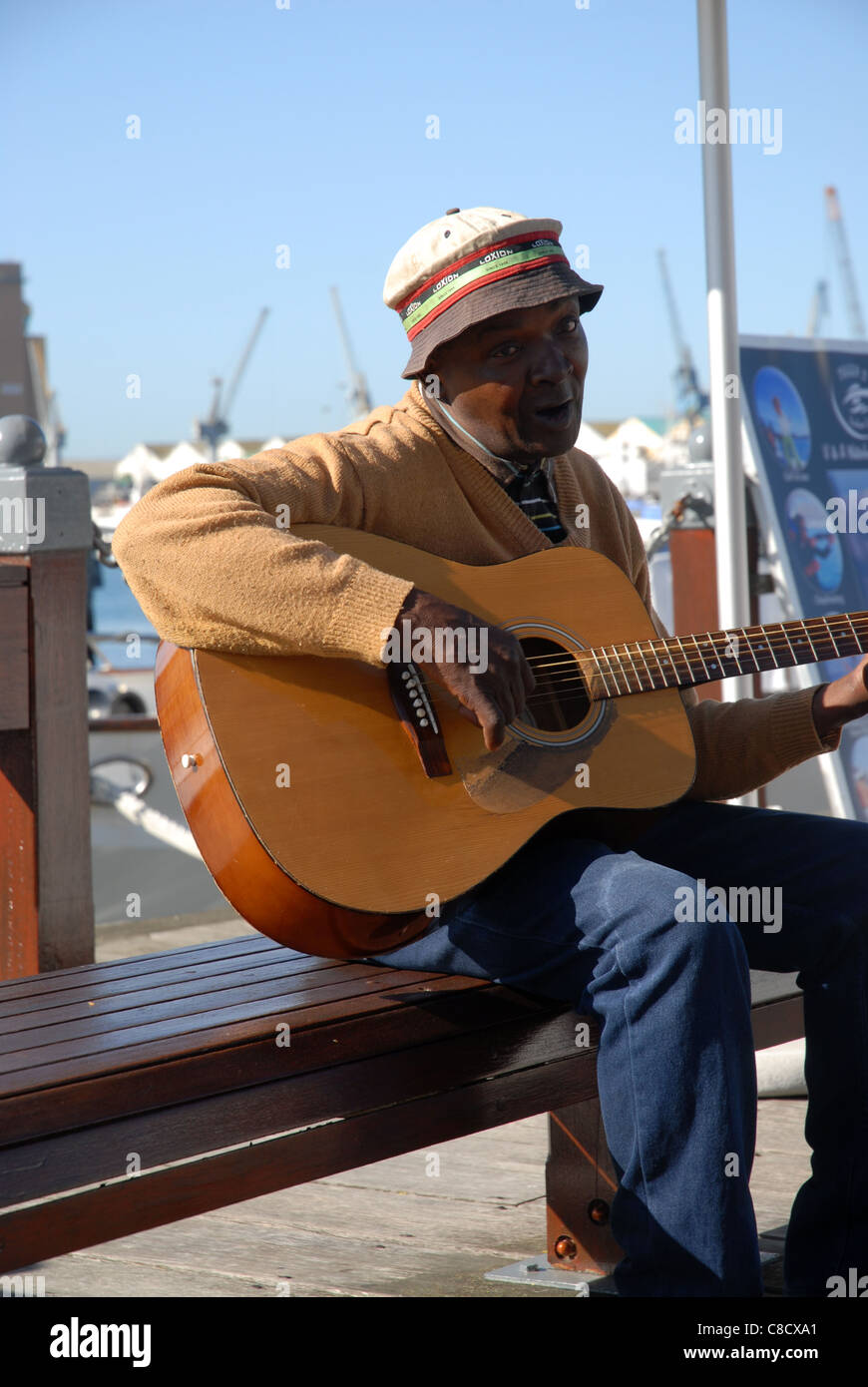 man playing guitar & busking, V&A Waterfront, Cape Town, Western Cape
