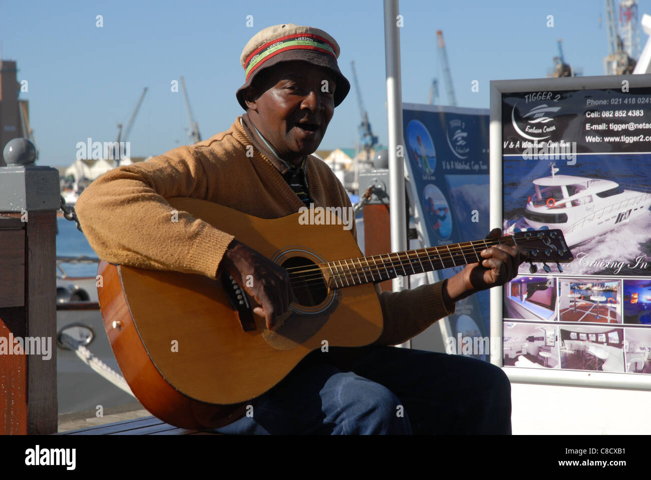 man playing guitar & singing, V&A Waterfront, Cape Town, Western Cape