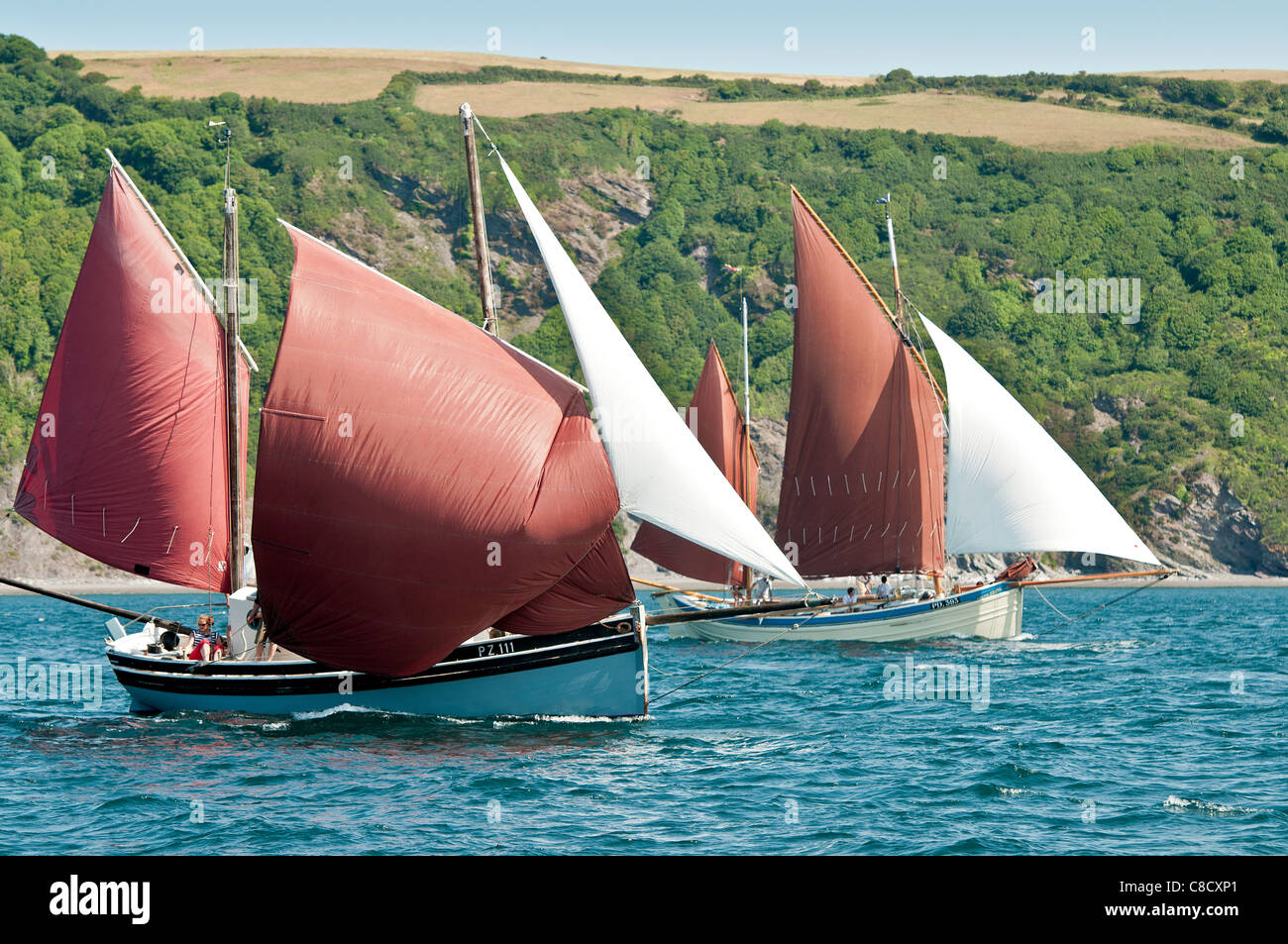 Cornish Luggers sailing in Looe Bay South East Cornwall Stock Photo