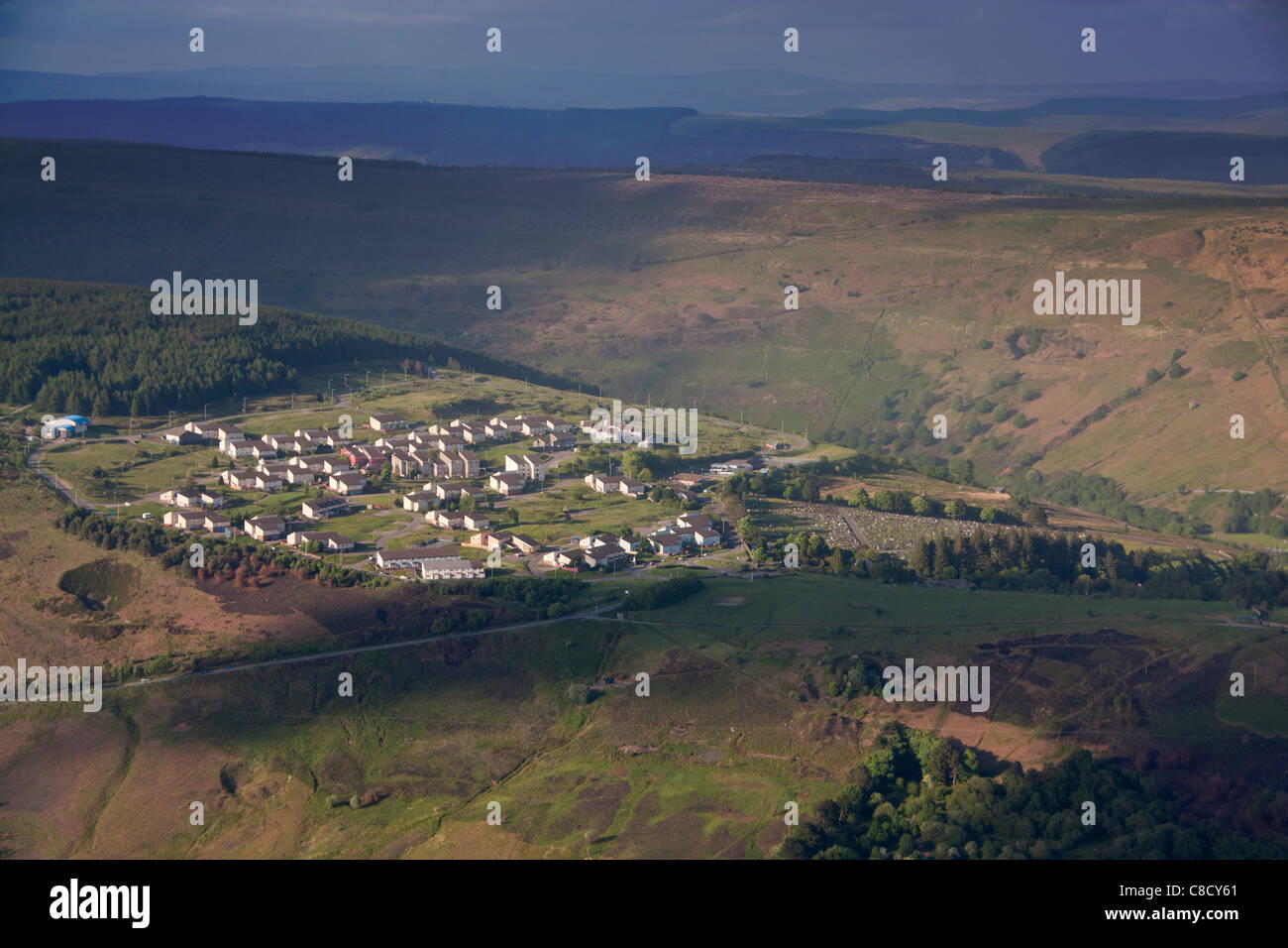 Penrhys council housing estate and cemetery on hilltop above Rhondda Valleys in dramatic evening light Valleys South Wales UK Stock Photo