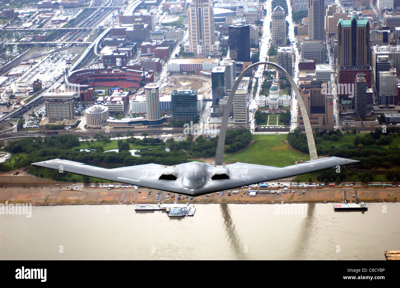 B 2 Spirit Stealth Bomber flying over the St. Louis Arch Stock Photo
