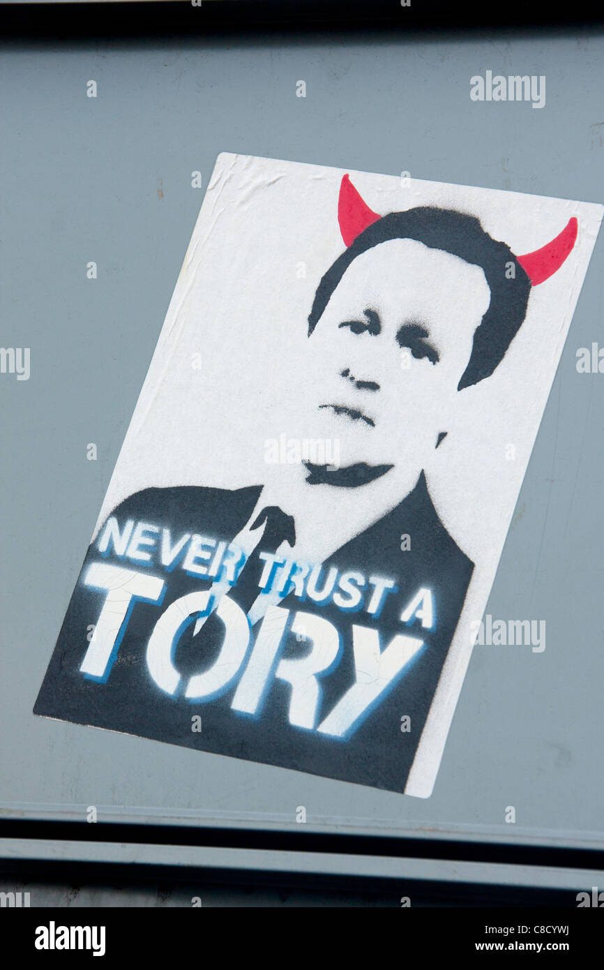 Never Trust A Tory Poster artwork of Prime Minister David Cameron with red devil horns Roath Cardiff Wales UK Stock Photo