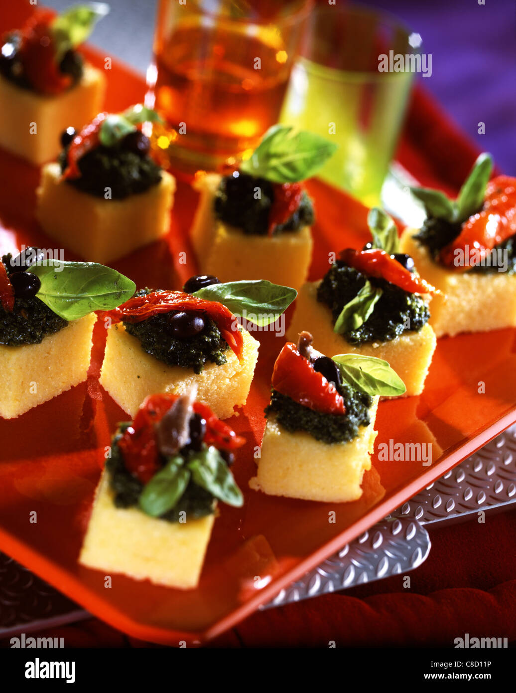Polenta and olive pesto appetizers Stock Photo Alamy