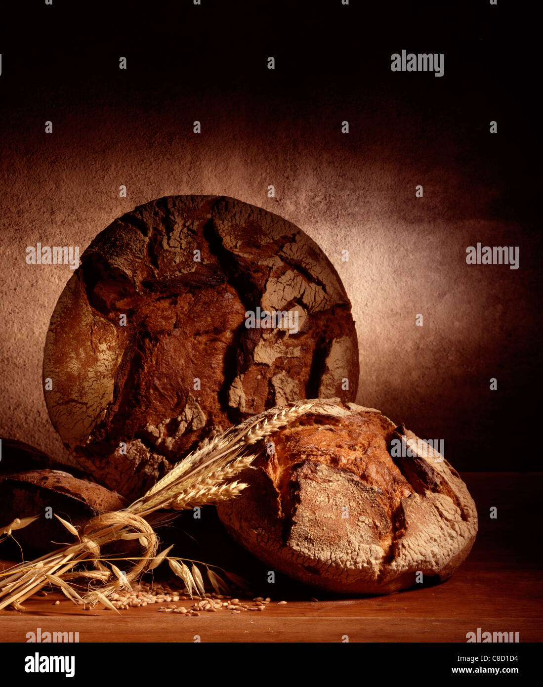 Round loaves of bread and ears of wheat Stock Photo - Alamy