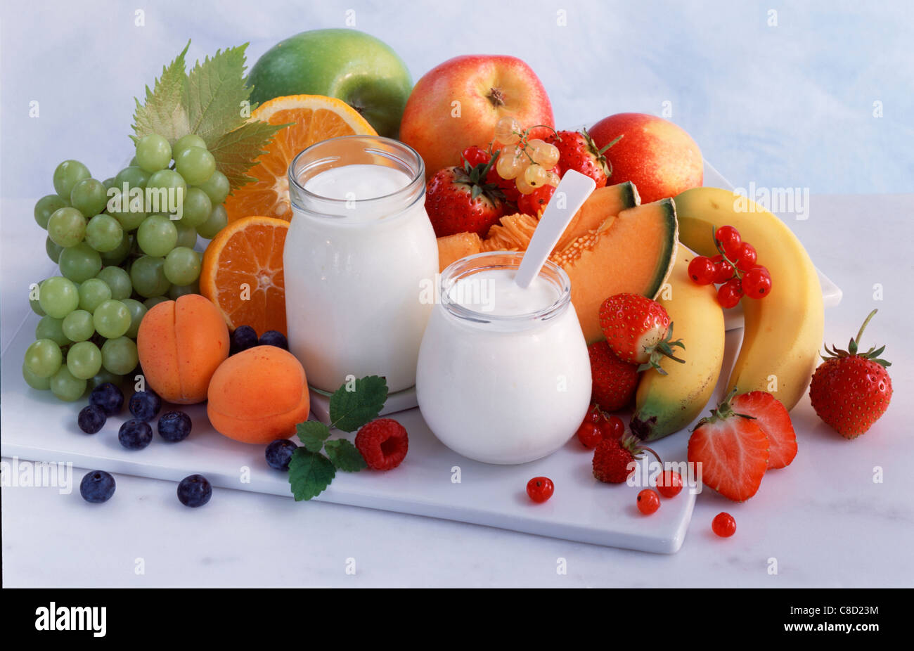 pots of plain yoghurt with assorted fresh fruit Stock Photo Alamy
