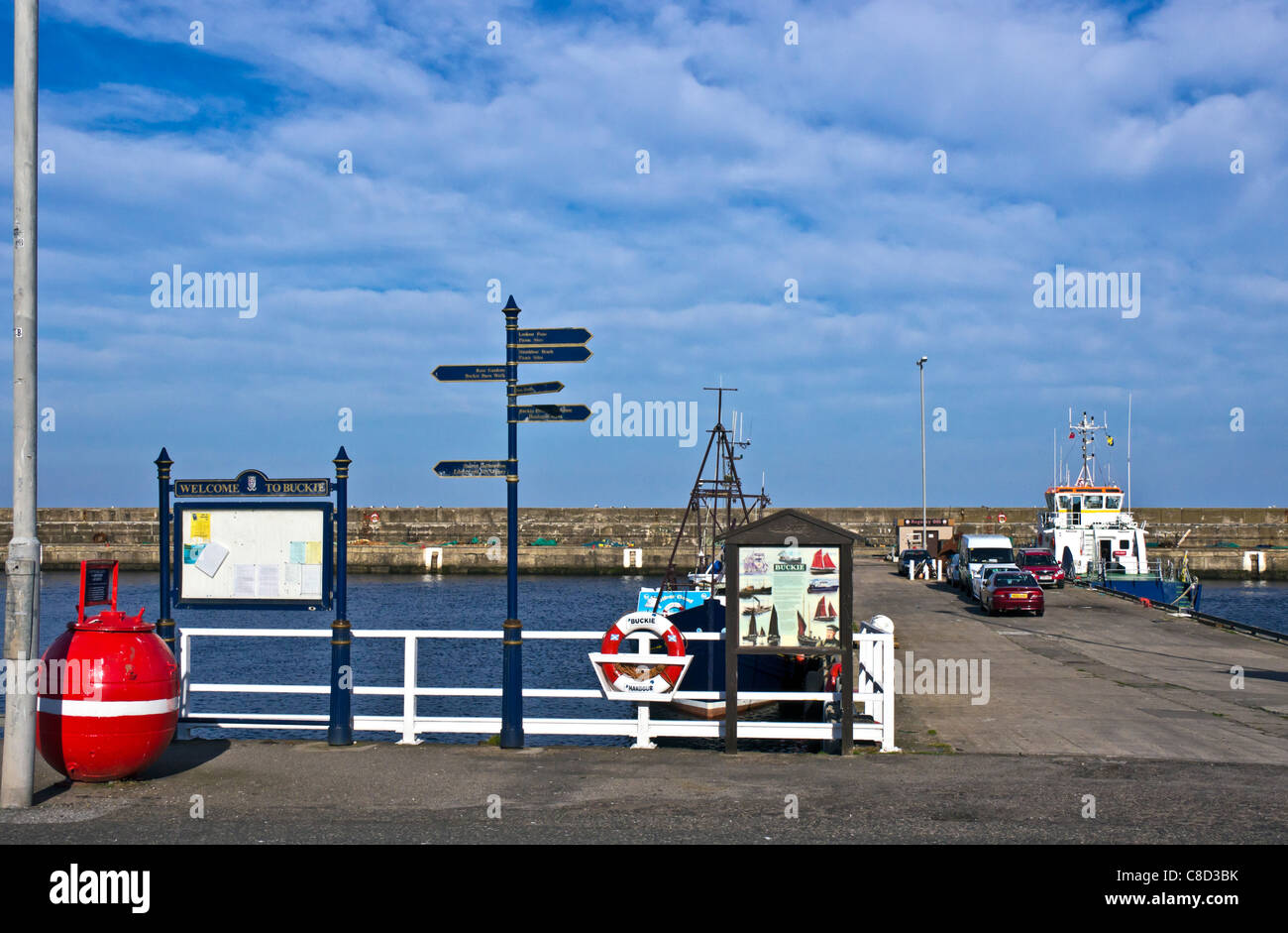 Signage and fishing boats at Buckie Harbour in Moray North East Scotland Stock Photo