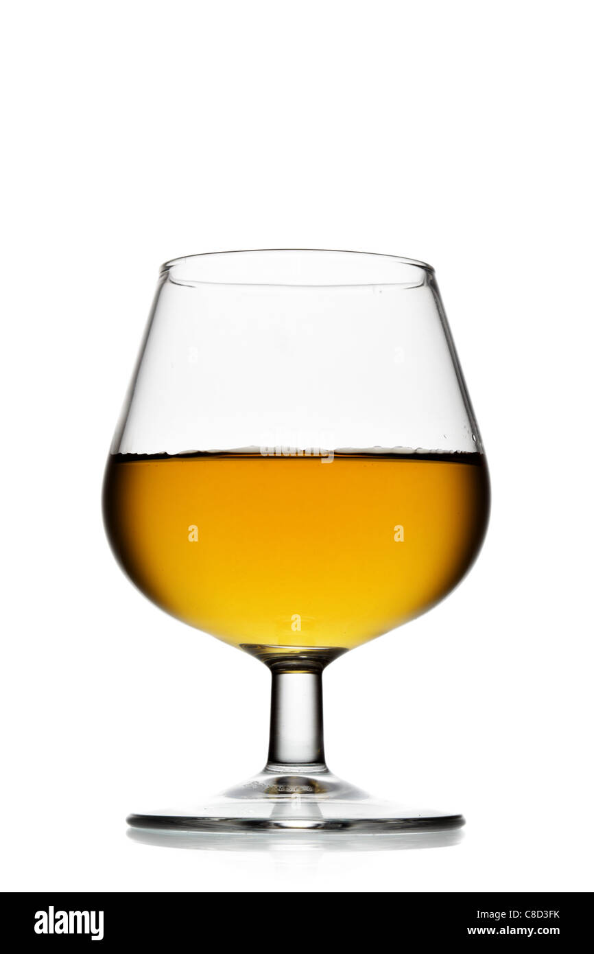 Snifter glass of brandy isolated over white background Stock Photo Alamy