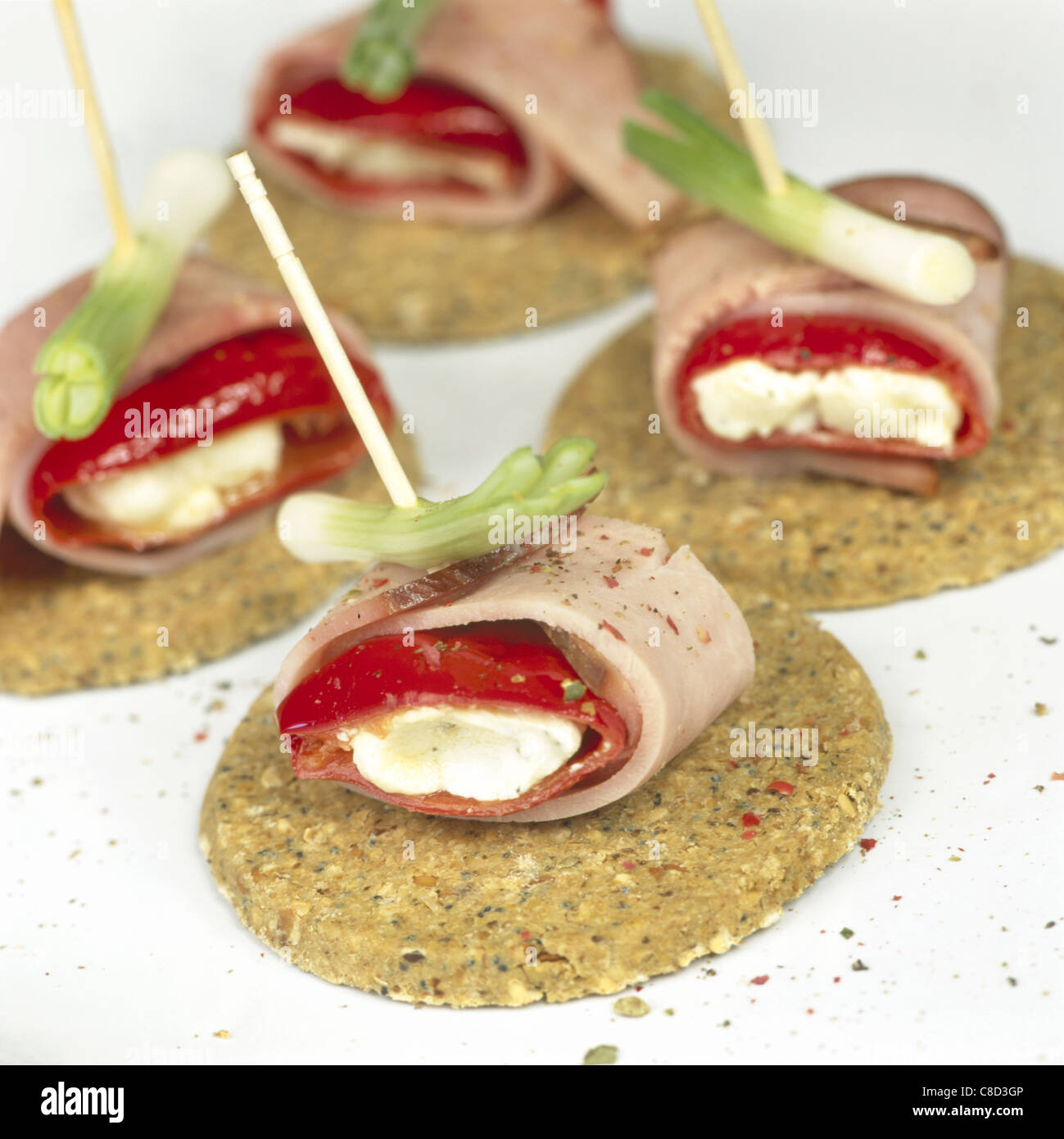 Oatcakes with smoked ham wrapped around cheesestuffed peppers