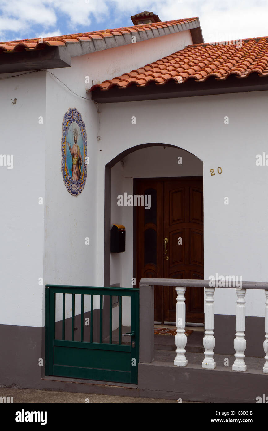 Azorean house with a painted Saint besides the door, São Miguel island, Azores. Stock Photo