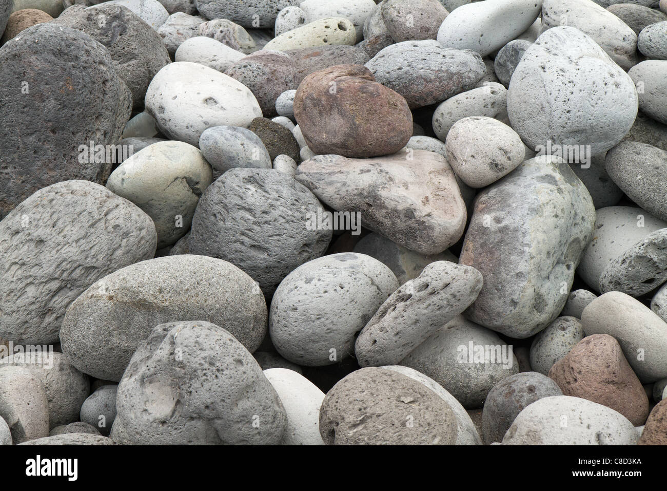 Pile of rounded rocks on the beach at Mosteiros, Azores. Stock Photo