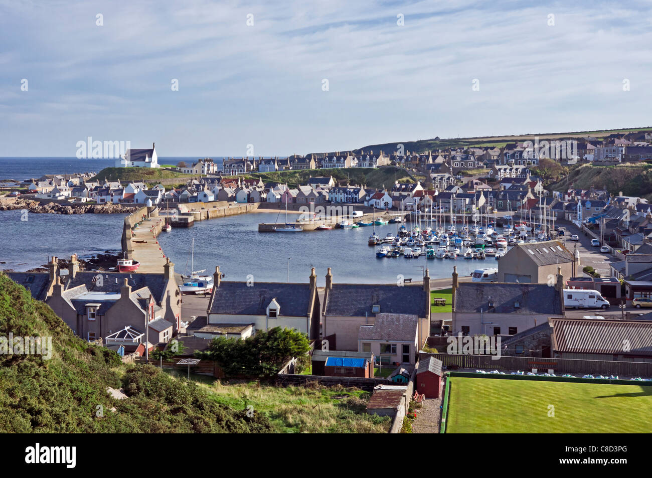 Findochty harbour in Moray North East Scotland with bowling green at the front right Stock Photo