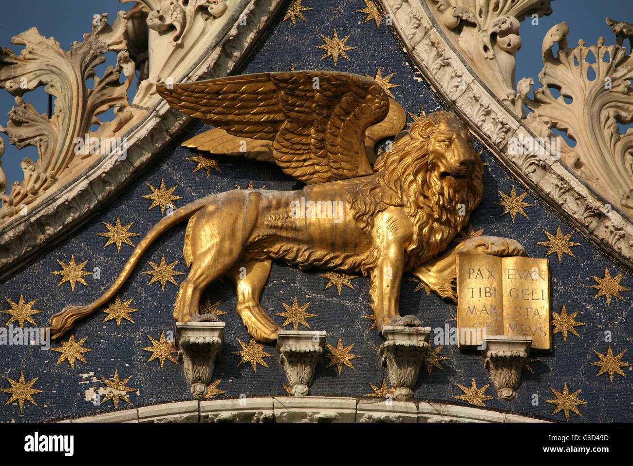 Lion of Saint Mark above the main gate of Saint Mark’s Basilica on Piazza San Marco in Venice, Italy. Stock Photo