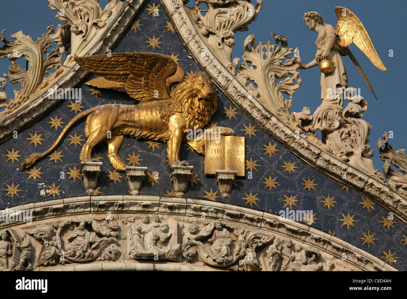 Lion of Saint Mark above the main gate of Saint Mark’s Basilica on Piazza San Marco in Venice, Italy. Stock Photo