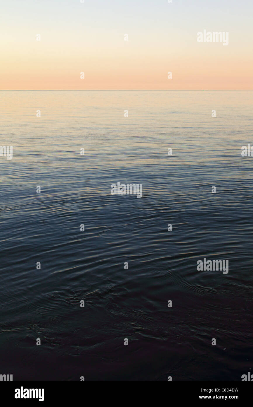 Calm sea at Helgoland in evening light. Stock Photo