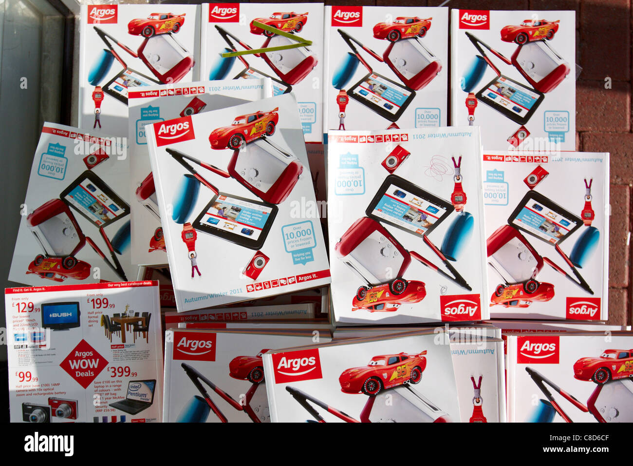 Catalogues piled outside a branch of Argos Extra in Aylesbury Stock Photo Alamy