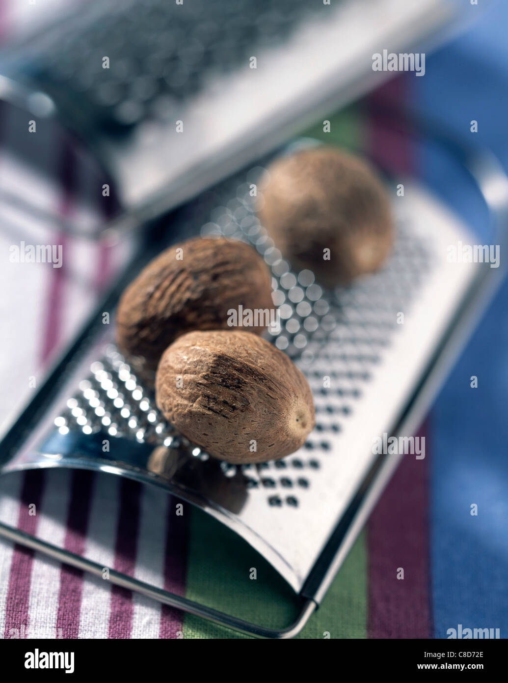 Nutmeg and grater Stock Photo Alamy