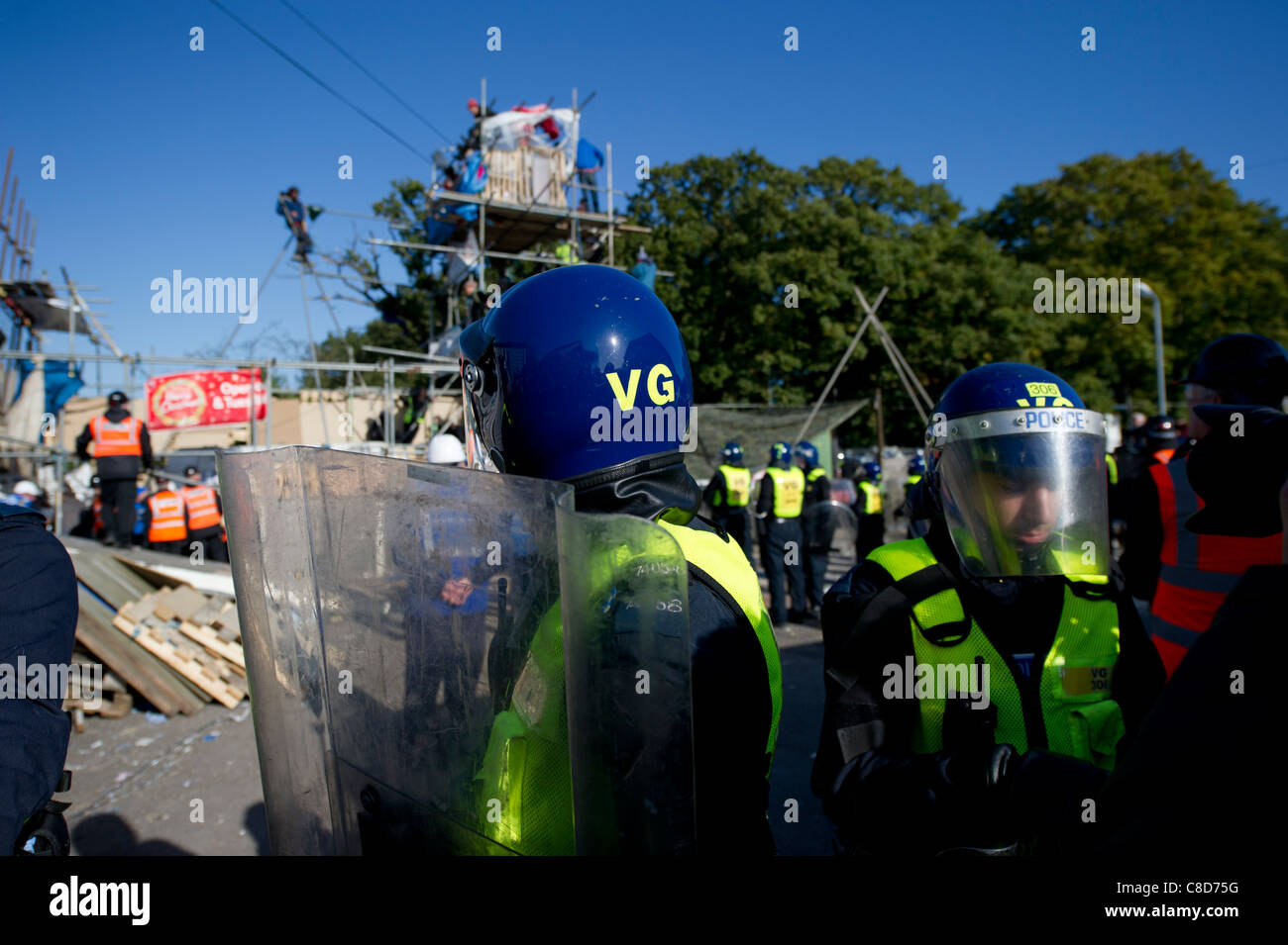 Group of police forces in uniform using riot shields for protection while  stopping activists outdoors Stock Photo - Alamy