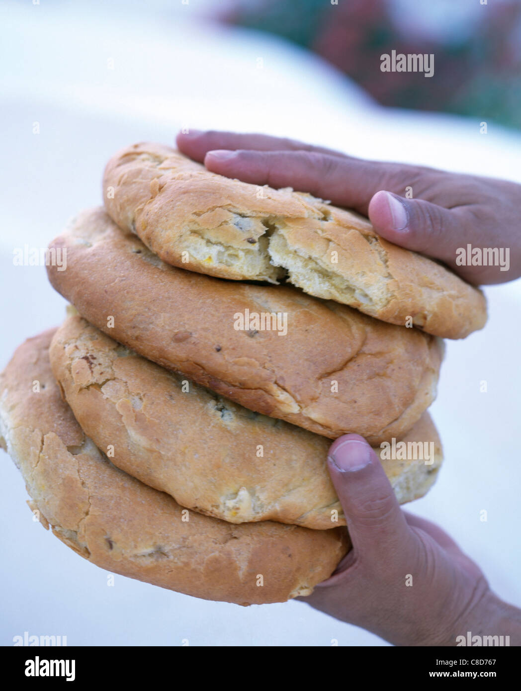 Tunisian flat bread with hands Stock Photo